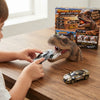 Child playing with the Dinosaur Launch Alloy Car Set featuring a dinosaur mouth launcher and alloy toy cars.