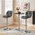 Adjustable Bar Stool and Table Set featuring sleek black bar stools and stylish table in modern kitchen setting.