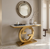 Modern Gold Circular Accent Console Table featuring a marble top and stylish gold base in a chic interior setting.