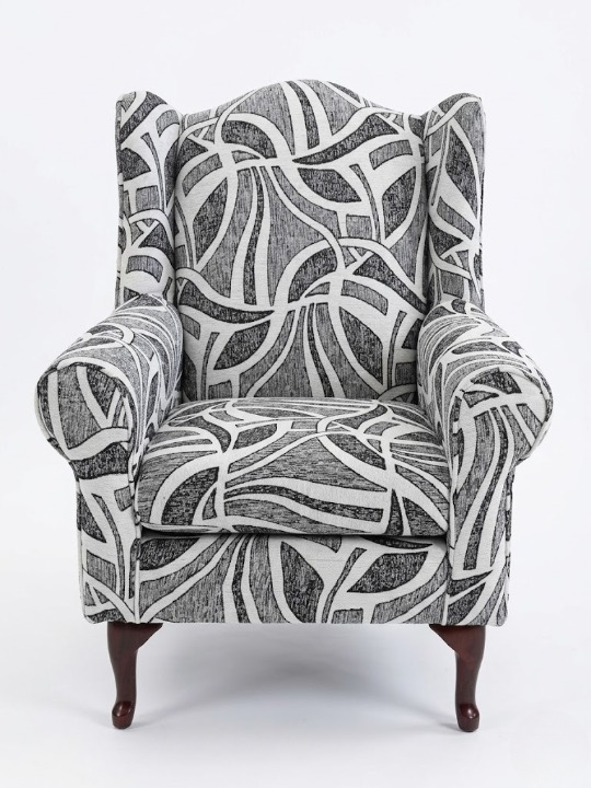 Serena Grey Fabric Wingback Chair with modern black and white pattern and sturdy wooden legs.