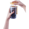 6 in 1 Baby Bottle Cleaning Kit Travel Set with hands holding the bottle cleaning tool.