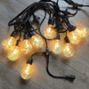 Outdoor LED String Lights showcasing glowing bulbs arranged neatly for outdoor ambiance.