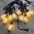 Outdoor LED String Lights showcasing glowing bulbs arranged neatly for outdoor ambiance.