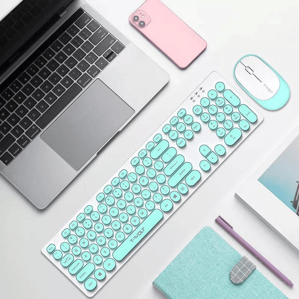 2.4 G Wireless Keyboard & Mouse Set – Ergonomic Quiet Retro Style on a workspace with a laptop and phone.