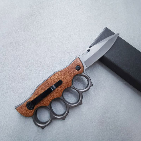 Tactical Trench Folding Knife with wood handle and knuckle guard, ideal for outdoor and self-defense use.