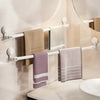 Multi-Functional Punch-Free Wall-Mounted Storage Rack holding several towels in a modern bathroom setting.