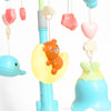 Close-up of adorable figures on a Rotating Musical Baby Crib Mobile with Projection, featuring a bear and colorful shapes.
