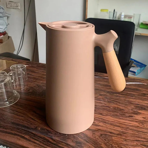 1L Nordic Large Capacity Coffee Pot in soft beige with wooden handle for easy pouring and serving.