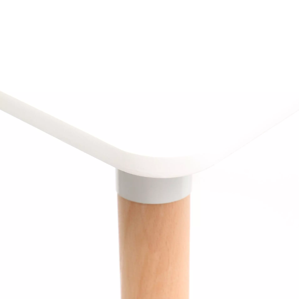 Corner view of the Modern Nordic Dining Table showcasing the smooth white surface and natural wood-look leg.