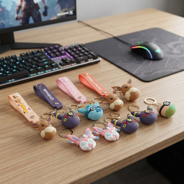 Silicone Animal Character Keychain collection displayed on a desk next to a gaming mouse and keyboard.