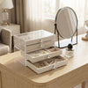3-Tier Clear Acrylic Jewelry Box with Velvet Drawers on a dresser showcasing organized jewelry.