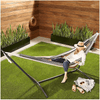 Portable Striped Hammock Swing Chair with a person relaxing outdoors in a garden setting.