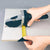 Professional Gypsum Board and Woodworking Cutting Tool in use measuring plasterboard with precise lines.