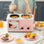 Multifunctional Breakfast Machine used to prepare various breakfast dishes including stir-fried vegetables and eggs.