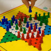Classic Chinese Checkers Board Game with colorful pieces in strategic arrangement on the board.