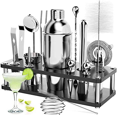 18 Piece Cocktail Shaker & Bar Tool Set with Wooden Stand displayed with bar ingredients and tools.
