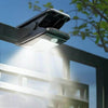 Solar Glow Clip Light attached to a fence, providing solar-powered illumination for outdoor spaces.