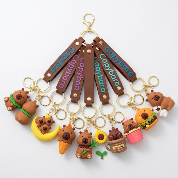Colorful Silicone Capybara Keychain assortment featuring various playful designs and accessories.