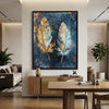 Framed Abstract Canvas Wall Art Piece featuring a blue background with gold and silver feather designs.