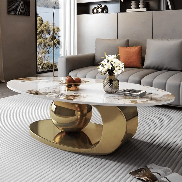 Heritage Marble Coffee Table featuring a polished marble top and gold base in a modern living room setting.