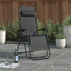 Deluxe Folding Lounger Chair with Headrest and Side Tray set in a garden, surrounded by plants and decorative pots.