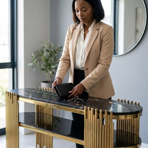A woman placing a wallet on a Stylish and Modern Console Table in a contemporary home setting.
