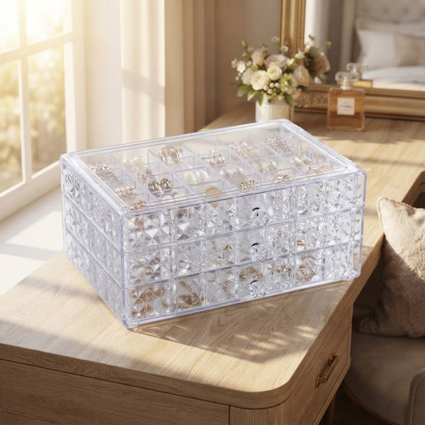 3-Layer Clear Acrylic Jewelry Organizer Box displaying organized jewelry on a wooden dresser.