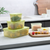 3-Piece Food Storage Container Set with fresh fruits and vegetables on a kitchen counter.