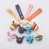 Silicone Animal Character Keychain featuring colorful animal designs and straps for easy attachment to bags and keys.