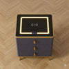 Smart Wireless Charging Bedside Table with Speakers featuring a glowing wireless charging pad and digital clock display.