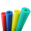 Colorful small pool noodles in red, blue, yellow, and green for swimming and water games.