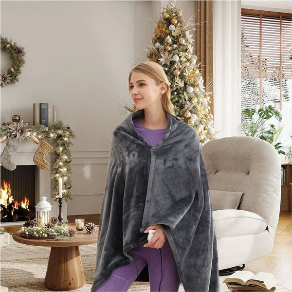 USB Heated Electric Shawl Blanket being worn by a woman in a cozy living room with holiday decorations.
