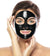Woman applying Charcoal Blackhead Removal Mask on her face for effective skincare.