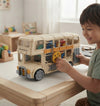 Child playing with Electric Gear Retro Double-Decker Bus Toy featuring an interactive gear mechanism.