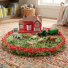 Happy Farm House Play Set featuring a toy farmhouse, animals, and a tractor on a green play mat.