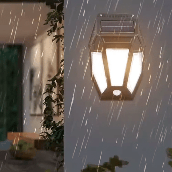 Solar Motion-Activated Wall Lamp illuminating a wall in rain, highlighting its outdoor functionality.