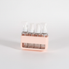 4-in-1 Acrylic Travel Refillable Bottles Set 50ml displayed in a convenient, stylish holder.