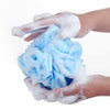 2 Piece Durable and Soft Shower Ball Sponge in hands creating rich lather with soft foam for gentle cleansing.