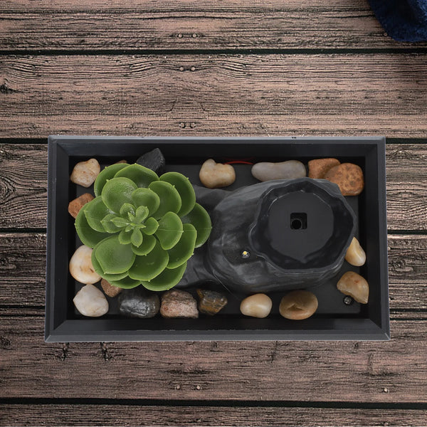 Solar Raindrop Tabletop Water Fountain with succulent and pebbles on wooden surface