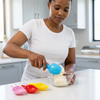 Person using 4PC Ice-Cream Super Scoopers to serve ice cream into a bowl in a modern kitchen.