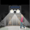 Solar LED Wall Light illuminating a pathway as a person walks by, enhancing outdoor security and visibility.