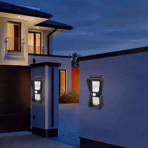 Solar Modern Outdoor Wall Light illuminating a modern home's exterior in the evening.