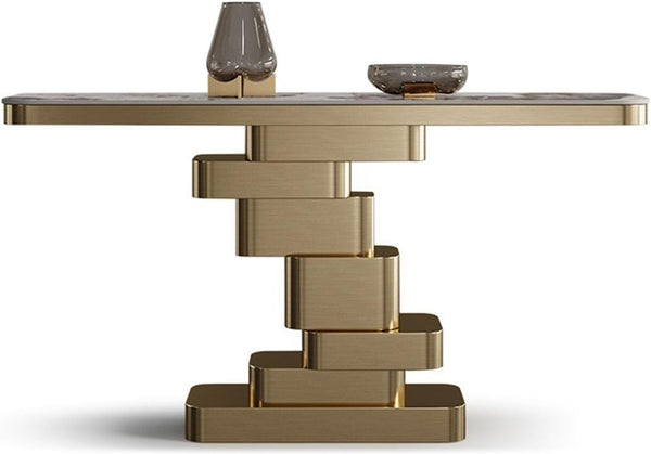 Contemporary Extra Long Faux Marble Console Table with a unique gold base and decorative items on top.