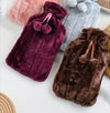 Insulated Hot Water Bottle with Soft Cover in various colors including burgundy and brown.
