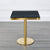 Square Marble Effect Dining Table with Gold Pedestal Base showcasing a sleek black marble top and polished gold pedestal.