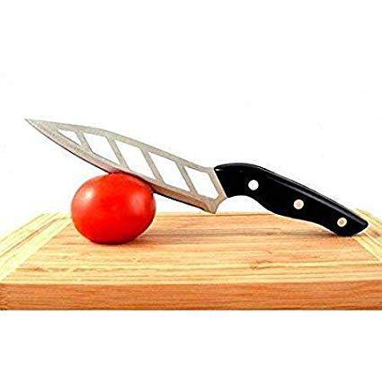 Aero Knife slicing a tomato on a wooden cutting board showcasing its aerodynamic blade design.