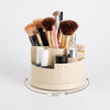 360 Degree Rotating Cosmetic & Makeup Brush Organizer with various brushes and beauty products, showcasing its rotating design.