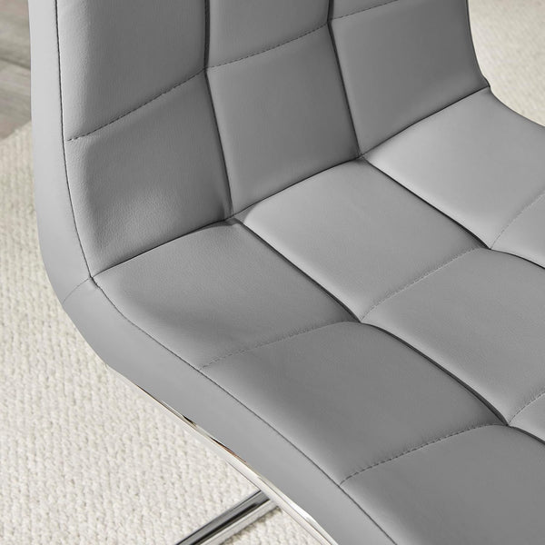 Close-up view of the Enzo Faux Leather C Frame Dining Chair showcasing its quilted upholstery.