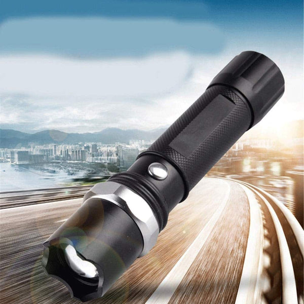 20 000 Lumen Adjustable LED Torch – High-Power Portable Flashlight on a winding road with city backdrop.