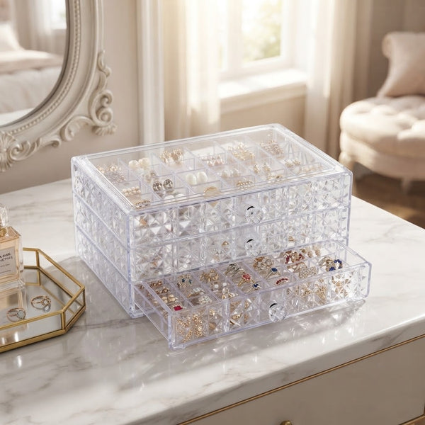 3-Layer Clear Acrylic Jewelry Organizer Box with neatly arranged jewelry displayed on a marble surface.